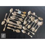 A parcel lot of Georgian and later teaspoons and sugar tongs to include fiddle and old English
