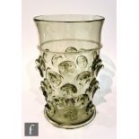 A 20th Century continental glass vase of cylindrical form, in a sea green tint decorated with