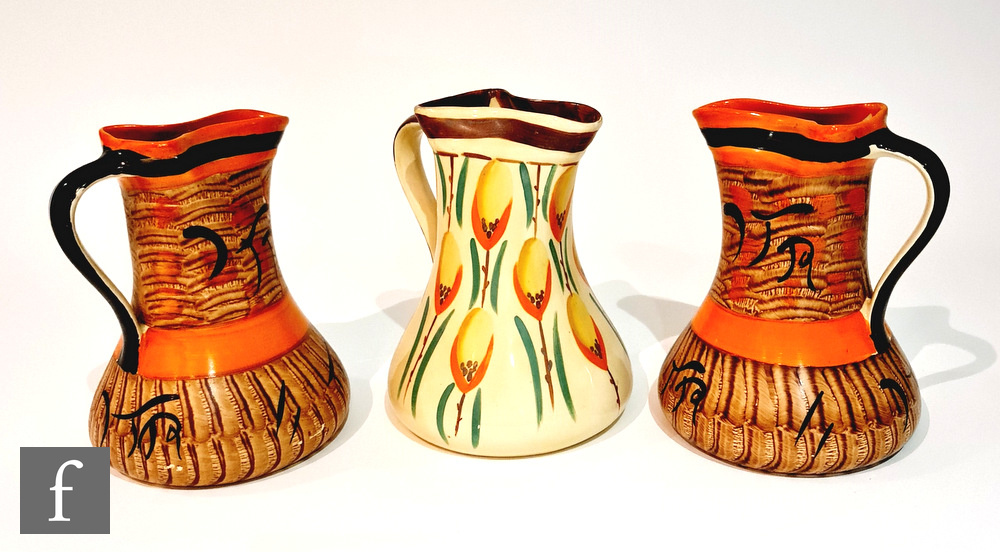 A pair of 1930s Art Deco Myott pinch jugs decorated in pattern 8387, the whole with brown painted