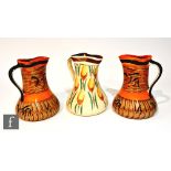 A pair of 1930s Art Deco Myott pinch jugs decorated in pattern 8387, the whole with brown painted