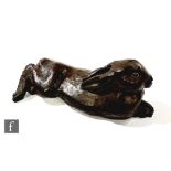 A contemporary cast resin sculpture of a recumbent hare in a bronzed finish, after D.J. Scaldwell,