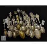 A collection of Edwardian commemorative teaspoons some with embossed and engraved bowls, each with