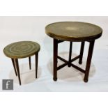 Two Indian circular brass topped occasional tables. (2)