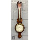 A 19th Century wheel or banjo barometer with thermometer, two inlaid shell paterae and silvered