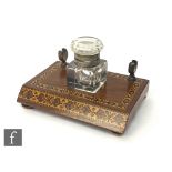 A 19th century Tunbridgeware inkstand with single square cut inkwell and pen holder, on bun feet,