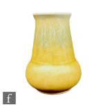 A small Ruskin Pottery crystalline glaze vase of globe and shaft form decorated with a tonal