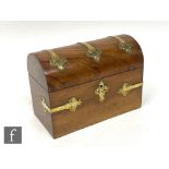 A mid Victorian domed walnut stationery box, mounted with brass Gothic strap decoration, later