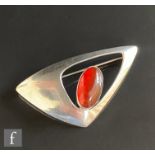 A Danish silver brooch of shaped triangular form set with central oval amber, length 6cm, Nils From.