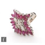 A 14ct white gold ruby and diamond cluster ring, twin central marquise and eight further diamonds