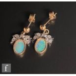 A pair of 9ct opal and diamond drop earrings, foliate diamond set stud above a collar set oval