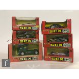 A collection of six Matchbox SCX slot cars, to include 86340 Mercedes Truck, 8377 Subaru Impreza,