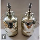 A pair of 20th Century table lamps made from glass demijohns with mercury silvered interiors, height