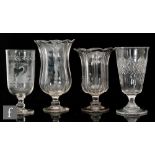 Four 19th Century clear crystal celery vases, the first with a flared bell form body above a knopped