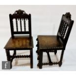 A pair of Victorian carved oak hall chairs, plank seats on turned legs. (2)