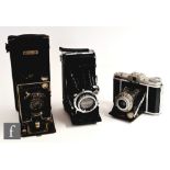 A Zeiss Ikonta C 521/2 pre war range-finder folding camera with 521/2 Novar 3.5/10.5 cm lens in a