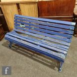 A Coalbrookdale style dark blue painted four seater wooden slat garden bench of scroll shape, height