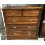 An Edwardian walnut straight front chest of two short and three long drawers, on plinth base, height