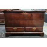 An 18th century oak mule chest, the moulded edge top over a plain front, on bracket feet, height
