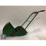 A 1950s Webb Miniature Lawn Mower for Children pressed steel toy with roller, rotating blades and