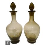 A near pair of Whitefriars decanters, each of footed ovoid form with collar neck and conforming