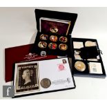 A cased set of six Elizabeth II Crowning Moments coins with a silver sovereign, a silver Krugerrand,