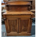 A small Victorian mahogany chiffonier, the architectural ledge back over a long frieze drawer and