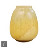 A Ruskin Pottery vase of swollen form decorated with a streaked pale blue to yellow ground,