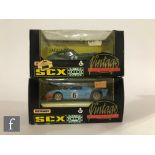 Two Matchbox SCX Vintage slot cars, 83710 Jaguar E Type and 83940 Ford GT40, both with boxes. (2)