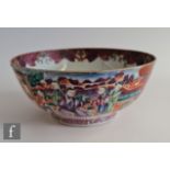 An 18th Century Chinese 'Mandarin' pattern punch bowl, rising from a high footring, decorated with