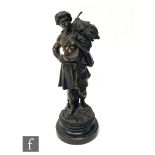 A 19th Century bronze figure of a gleaner carrying wheat sheaves and a stick, by Emile Boyer, signed