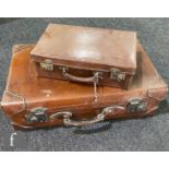 An early 20th Century leather suitcase with a lined interior, stamped with the monogram W.E.P, width