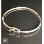 A Danish silver torque bangle terminating in a hook and eye hinged clasp, numbered 212 and stamped