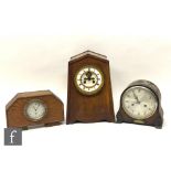 A Smiths car clock No 122459 in later oak case, another Smiths clock and an oak cased mantle