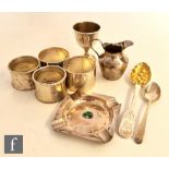 A small parcel lot of assorted hallmarked silver items to include two pairs of napkin rings, egg