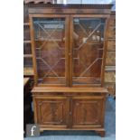 A late 20th Century mahogany bookcase in the George III style