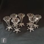 A set of seven early 20th Century John Walsh Walsh clear crystal glass posy vases with fluted body
