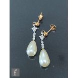 A pair of 9ct cultured pearl and diamond drop earrings, four vertically set diamonds terminating