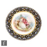 A late 19th Century Sevres cabinet plate, transfer decorated and hand painted to the central well