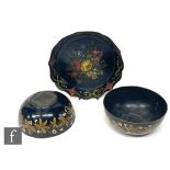 A pair of 19th century Theford patent papier-mâché bowls decorated with a border of white berries