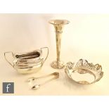 Four items of silver to include a sugar basin, a small bon bon dish, a trumpet vase and a pair of