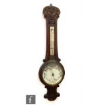 A Victorian carved oak aneroid barometer, height 90cm.