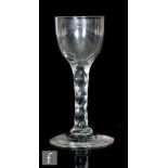 An 18th Century wine glass circa 1785, the round funnel bowl above a hexagonal faceted stem,