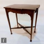 A nest of three line inlaid walnut occasional tables on splayed legs, width 53cm the largest, and