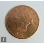 An American gold twenty dollar piece dated 1883.