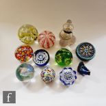 A small assorted collection of paperweights to include Caithness Glass millefiori examples,