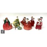 Eight Royal Doulton figurines comprising Christmas Morn HN1992, Lady Charmain HN1949, S/D, Genevieve