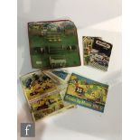 A Britains 7167 Farm Set, including pigs and accessories, sealed to original card, with a small