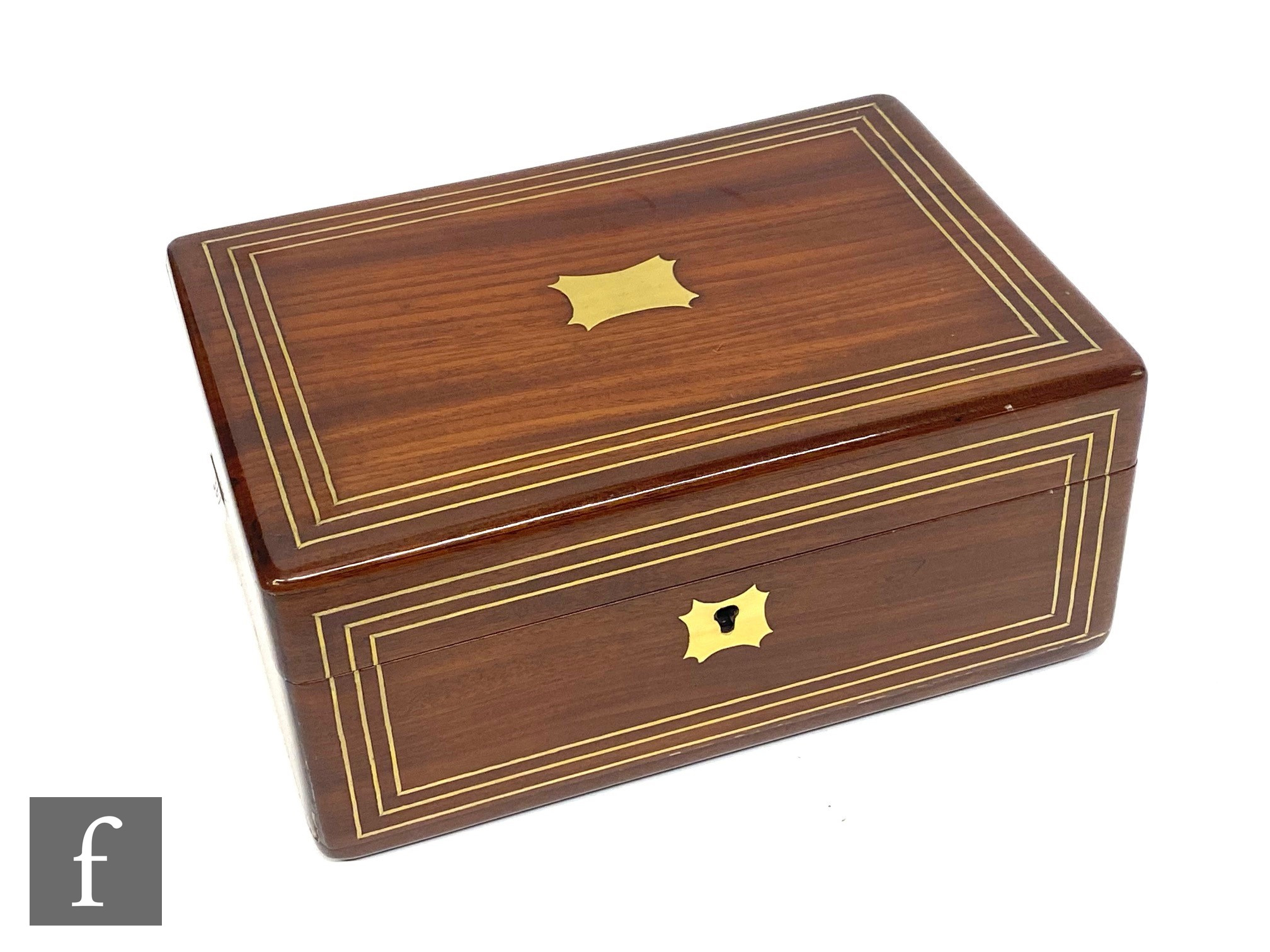 A Regency rosewood gentleman?s dressing case, the triple strung brass lid opening to reveal a red