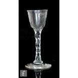 An 18th Century wine glass circa 1785, the round funnel bowl above a hexagonal faceted stem,