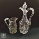 A 19th Century clear cut crystal claret jug with mitre cut panel body beneath a tapered neck with